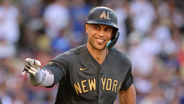 American League outfielder Giancarlo Stanton (27) of the New York Yankees reacts after hitting a two-run home run against the National League during the fourth inning of the 2022 MLB All Star Game
